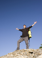 Man on top of mountain.