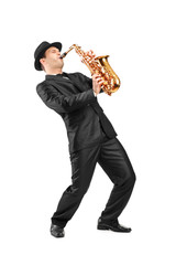 Portrait of a man in a suit playing on saxophone