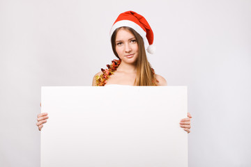 Christmas woman in santa hat with blank billboard