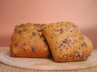 Bread and rolls on a cherry wood table
