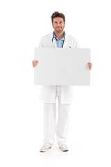Casual doctor holding blank sheet smiling