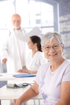 Elderly lady at health control smiling