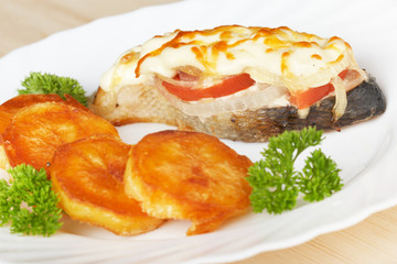 Salmon baked with potatoes