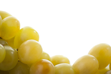 Close-up of a bunch of grapes on a white