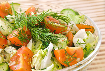 Fresh vegetable salad with tomato, lettuce, cucumber