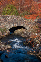 Ashness Bridge.  This picturesque humped back bridge crosses Barrow Beck and is a landmark close to Derwentwater in the English Lake District national park.