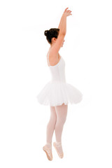 young and beautiful ballet dancer jumping on white background