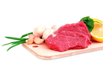Beef steak  on meat hardboard with mushroom  and lemon.