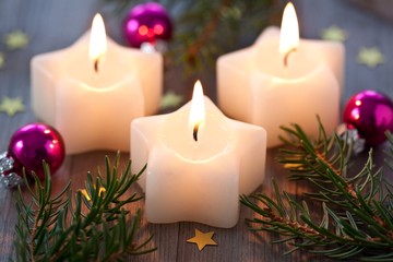 Three christmas star candles