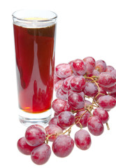 Grape cluster and juice in glass