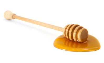 wooden honey dipper with honey