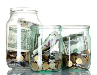 Glass bank for tips with money isolated on white