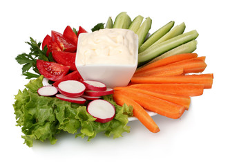 Chopped vegetables and sauce on plate isolated on white