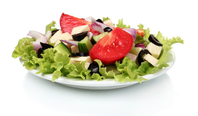 Tasty greek salad on plate isolated on white