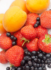 Fototapeta na wymiar Apricots, Blueberries & Strawberries