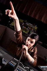 Soundboard technician doing a sound check