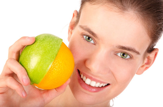 Smiling girl with half an apple and half an orange