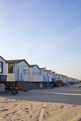 Little houses on beach in The Netherlands