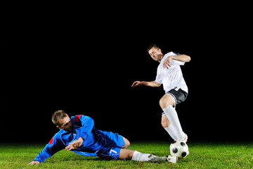 Obraz na płótnie Canvas football players in action for the ball