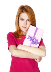 Fototapeta premium Sad red-haired girl with present box.