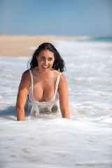 Fototapeta premium Beautiful woman on the beach similing