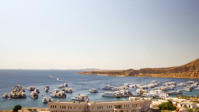 Time lapse of boats moving in the marina.