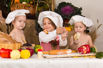 Kids dressed as chefs cooking