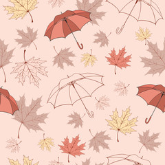 Seamless background pattern of autumn leaves and umbrellas.