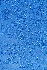 Water drops on a grey-blue background
