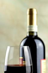 Glass and bottle of fine Italian red wine, closeup