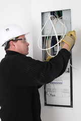 Electrician installing electric meter