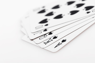 Royal flush of spade on white background