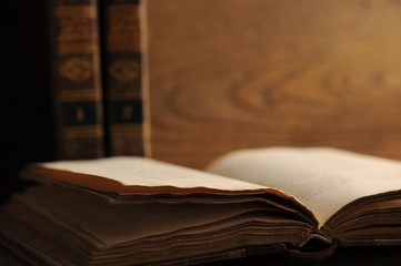 old book open on a wooden table