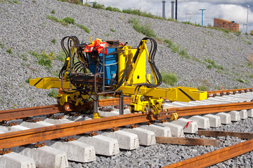 Railroad track construction machine