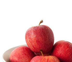 white bowl with apples on white background