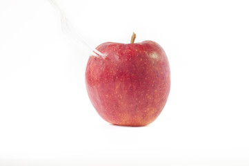 Red apple spoon on white background