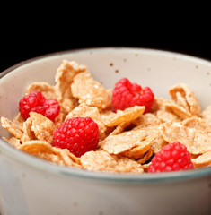 Cornflakes with milk and raspberries