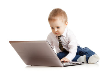Cute child using laptop