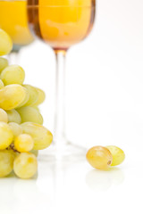 Still-life with bunch of grapes and white wine