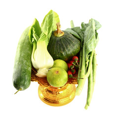 Vegetables mix on golden tray on white background