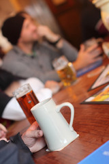 People drinking beer at a tavern