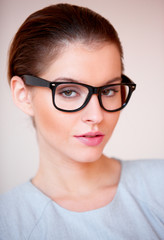 Young attractive business woman with glasses