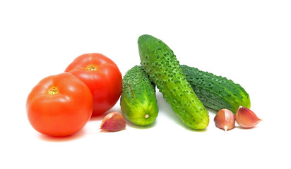 tomatoes, cucumbers and garlic on a white background