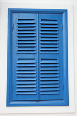 painted blue louvre shutters on mediterranean window