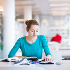 female college student in a library