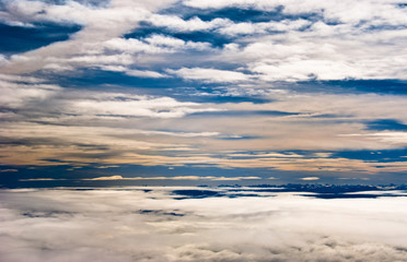 Obraz premium Clouds over mountains background in blue sky