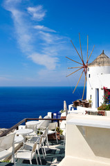 Lovely terrace and a windmill in Oia - Santorini - Greece