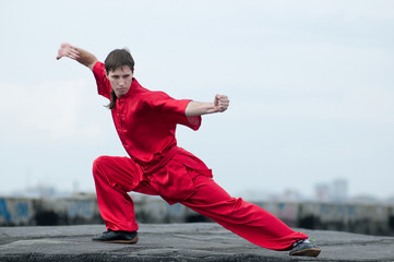 Wushoo man in red practice martial art