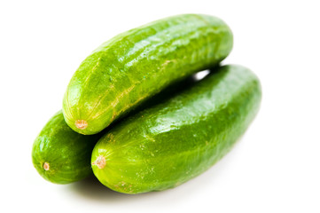 Healthy food. The green cucumbers isolated on white background