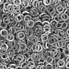 Pile of stainless steel spring washers, a shop floor item